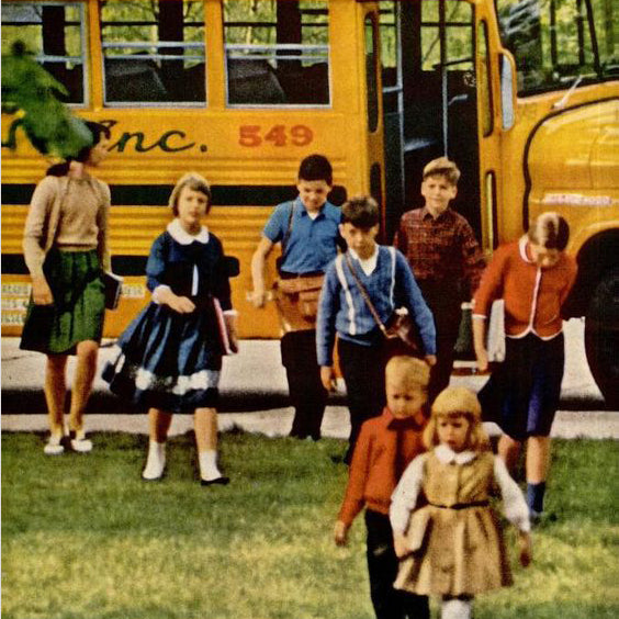 1960's yellow school buss with kids exiting
