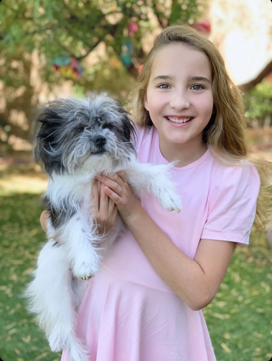 Girl with little do wearing our short sleeve pink dress