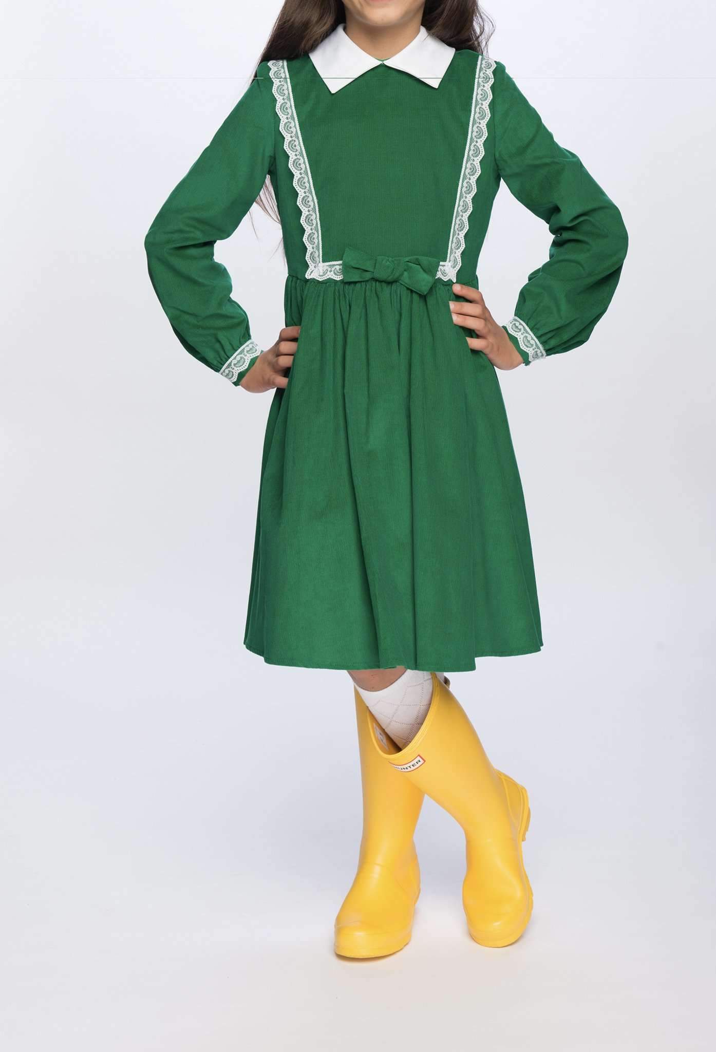 Girl modeling Payton Dress in Green with Yellow Boots